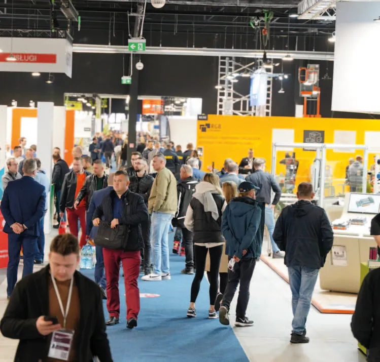 Visitors walking the exhibition hall